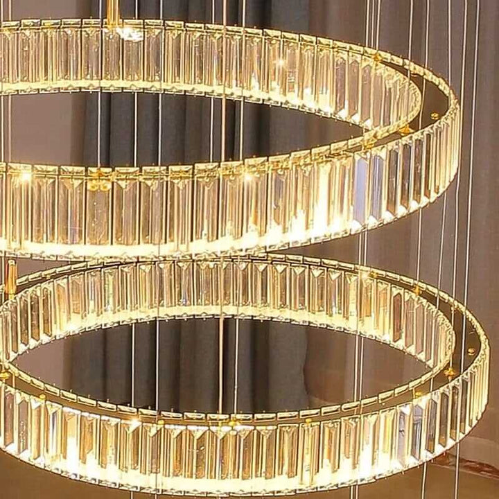 Elegant circle ring LED crystal chandelier illuminating a stylish interior space.