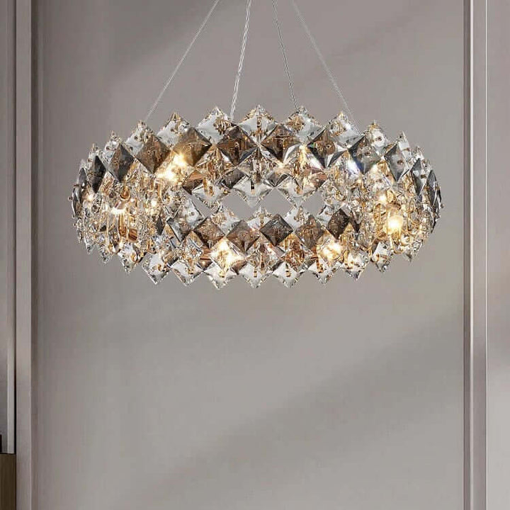 Elegant round chandelier with crystal elements reflecting light in a modern living room setting.