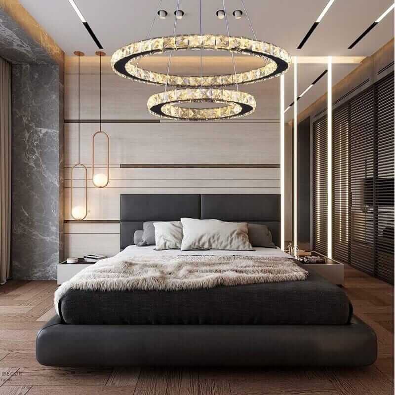 Stylish bedroom featuring a foyer chandelier that adds elegance and modern ambiance to the space.