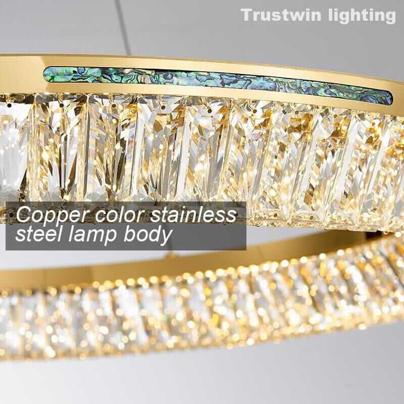 Foyer chandelier featuring copper color stainless steel body and K9 crystal accents for a luxurious lighting look.