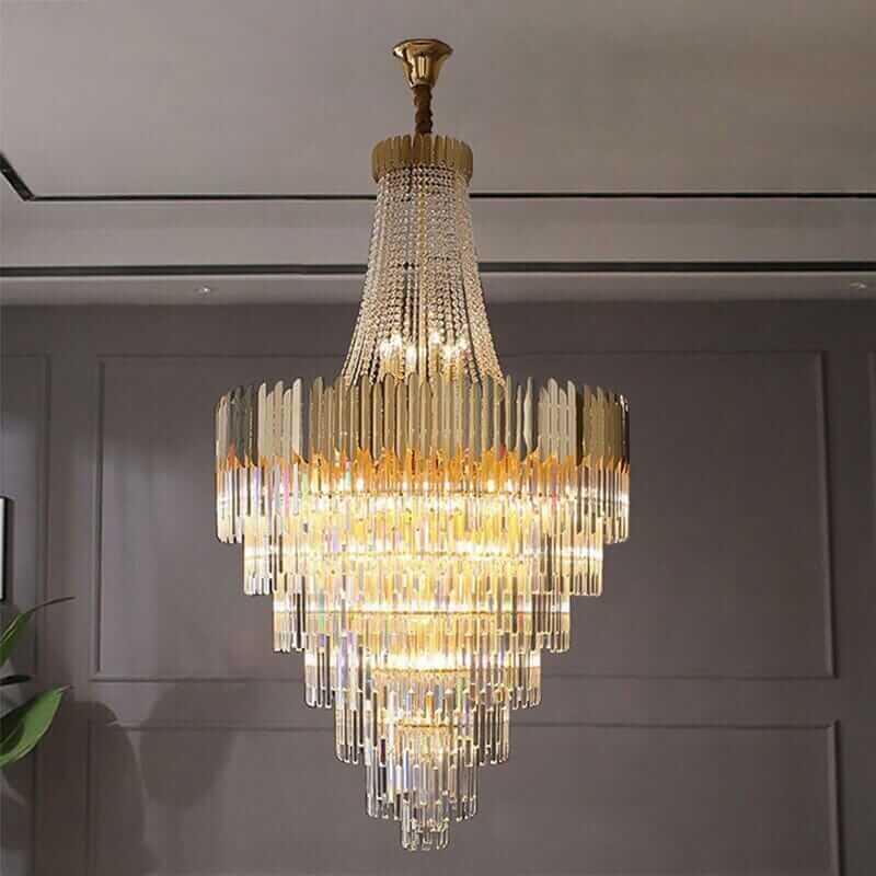 Elegant foyer chandelier featuring premium crystals and a stunning gold frame, creating a radiant light display.