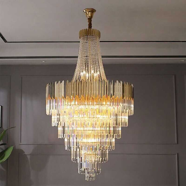 Elegant foyer chandelier featuring premium crystals and a stunning gold frame, creating a radiant light display.