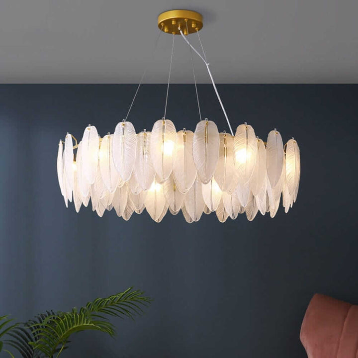 Stylish entryway chandelier with light shades resembling feathers, providing contemporary elegance and efficient lighting.