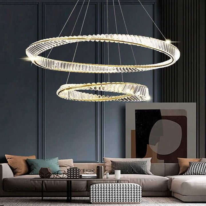 Gold chandelier pendant light illuminating a modern living room with luxury decor and comfortable seating.