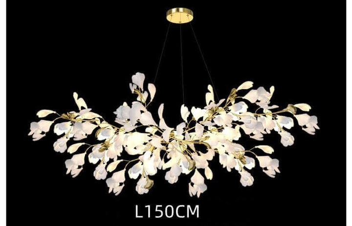 Floral chandelier with white petals, golden accents, providing soft, inviting glow for home decor.