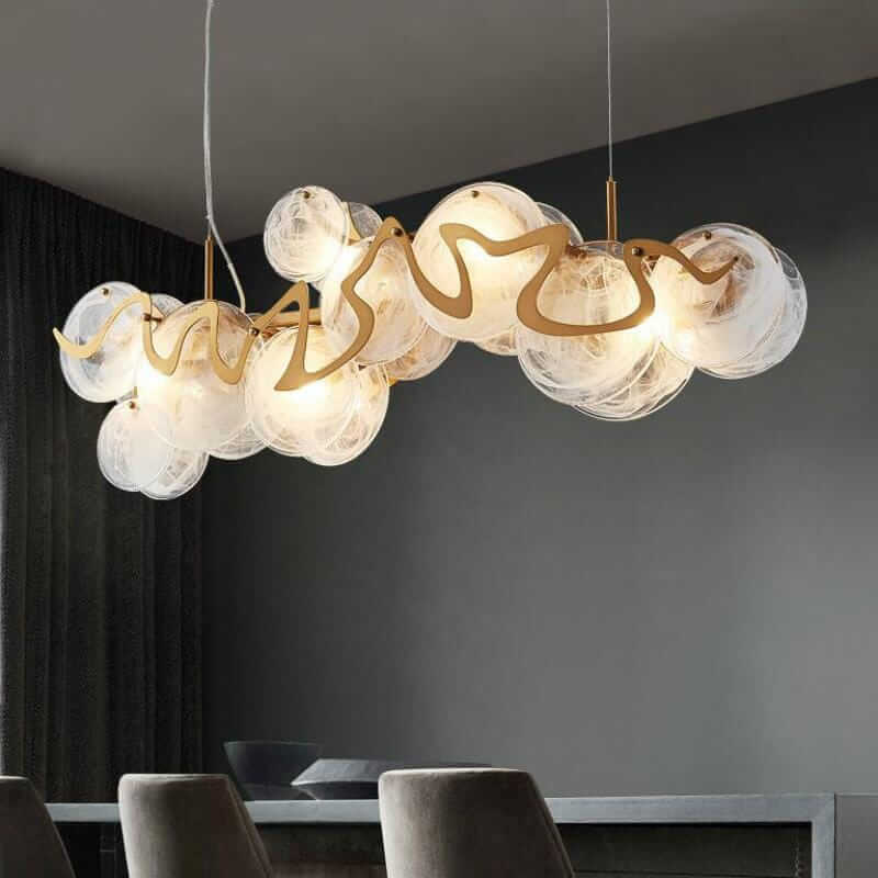 Elegant gold chandelier with glass globes, showcasing timeless beauty and contemporary design for modern interiors.