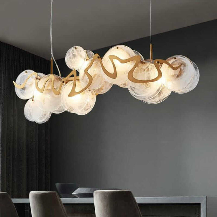 Elegant gold chandelier with glass globes, showcasing timeless beauty and contemporary design for modern interiors.