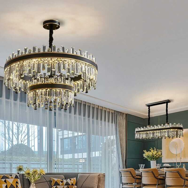 Elegant foyer chandelier with crystal elements illuminating a stylish dining space.