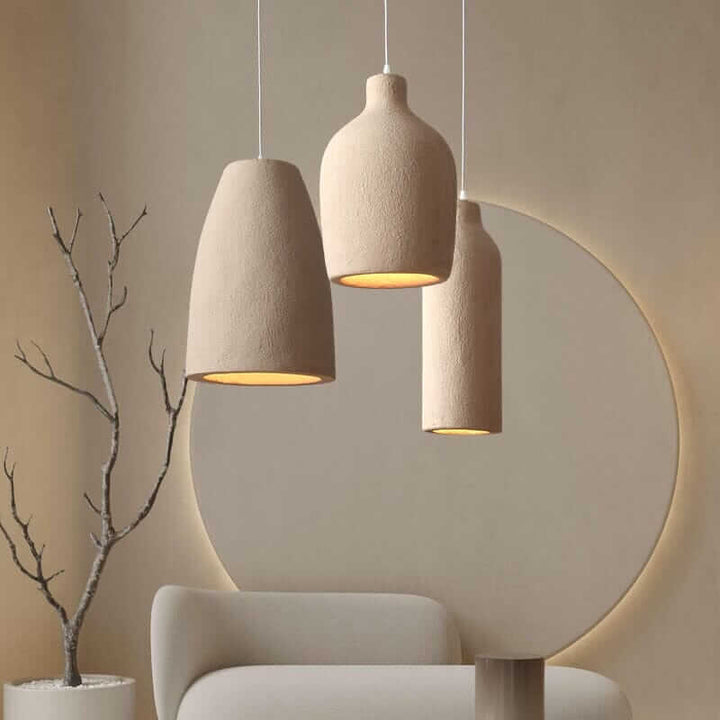 Wabi Sabi Pendant Light showcasing three textured beige lamps, adding cultural art to modern living room decor.