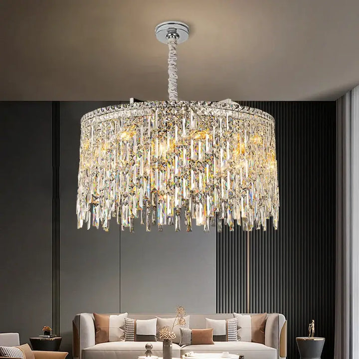 Elegant round chandelier with crystal accents illuminating a modern living room.
