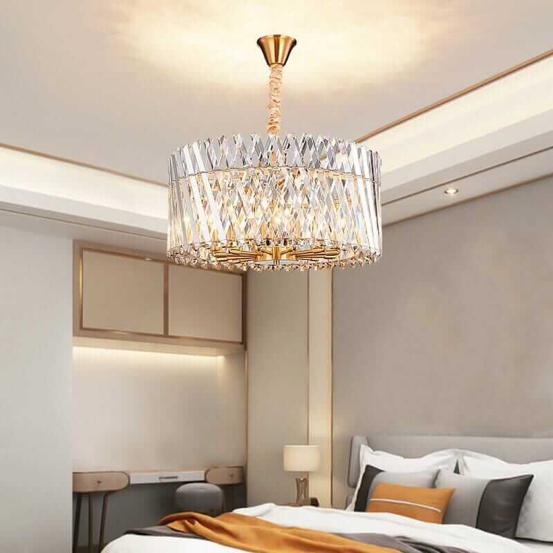 Luxury crystal transparent LED lamp hanging in modern bedroom decor above bed, enhancing elegance and ambiance.