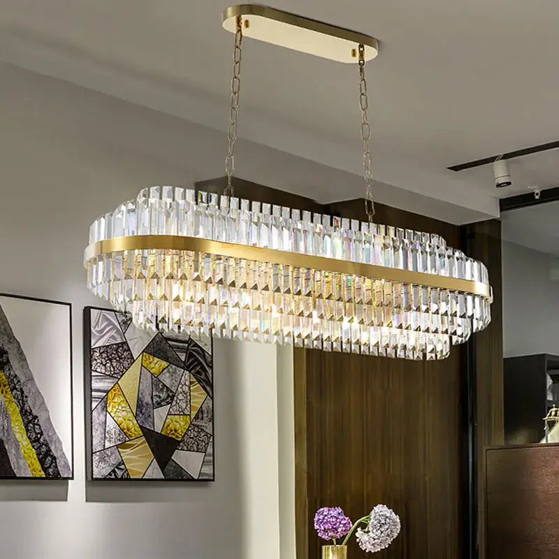 Elegant gold chandelier with crystal details, perfect for modern or traditional home decor.