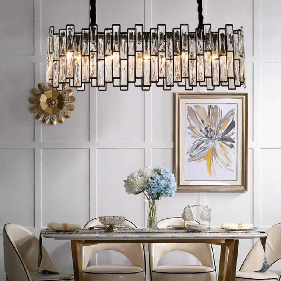 Modern LED chandelier with crystal accents hanging above an elegant dining table, enhancing luxury and ambiance.