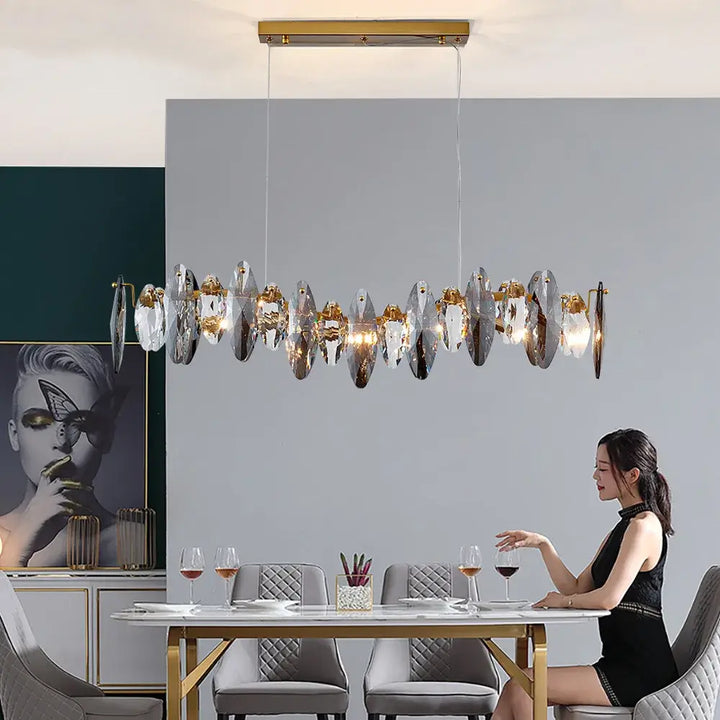 Elegant Long Restaurant Crystal Chandelier illuminating a dining area with sophisticated design and ambient light.