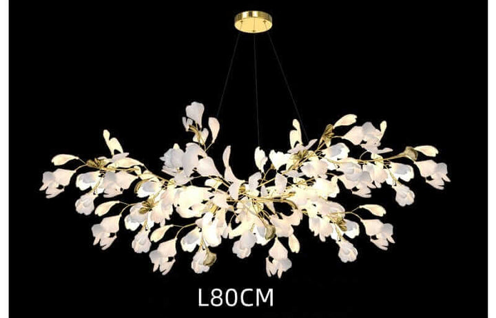 Floral chandelier with white petals and gold accents, perfect for enhancing home decor ambiance.