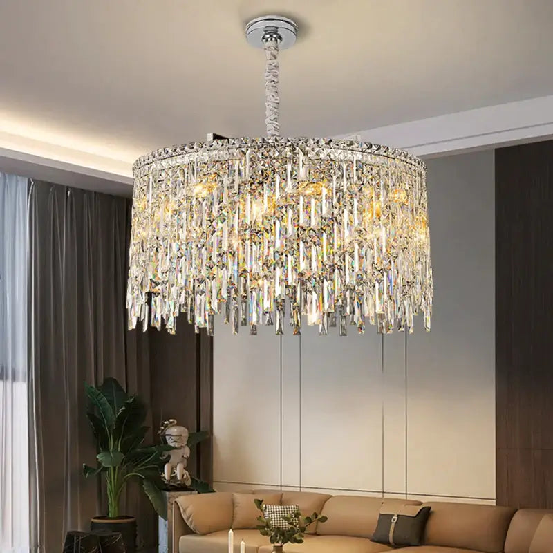 Elegant round chandelier with crystal accents illuminating a stylish living room space.