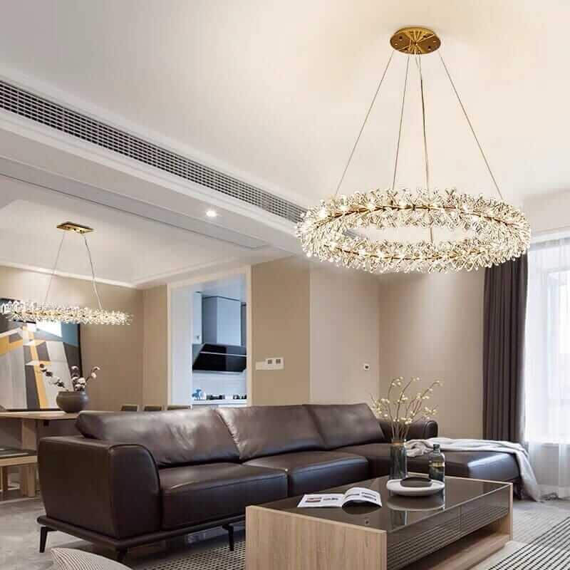 Elegant LED chandelier in a modern living room, featuring sparkling crystal elements and a glamorous flower design.