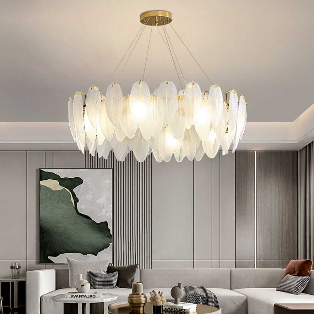 Stylish entryway chandelier with leaf-shaped glass design, illuminating a contemporary living room with elegance.