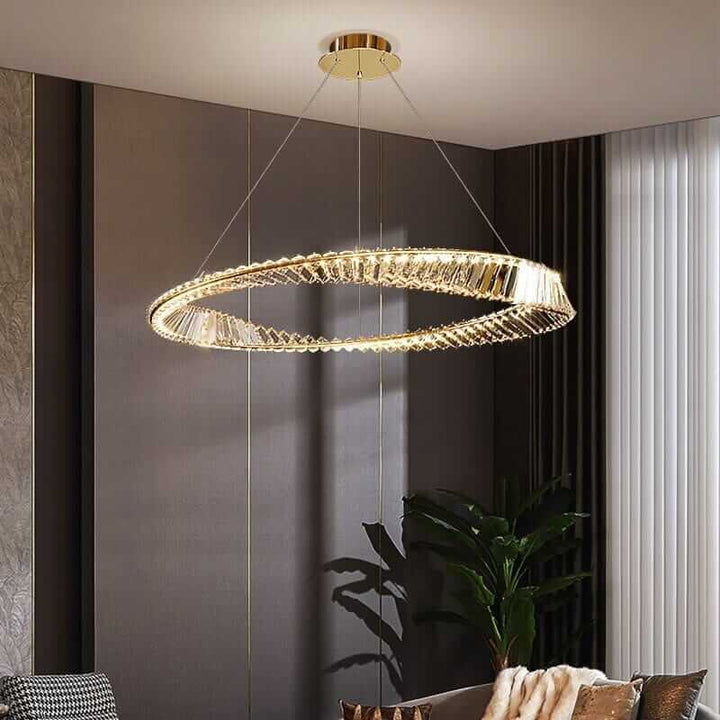 Gold chandelier illuminating a stylish living room, creating a luxurious ambiance with warm light.