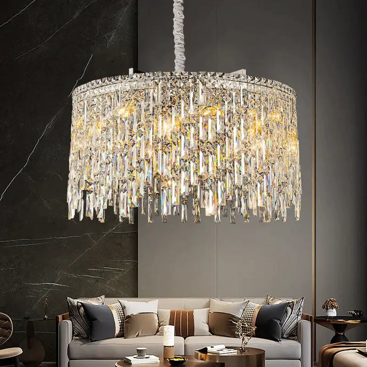 Round chandelier illuminating a stylish living room, featuring crystal accents that add elegance and charm.