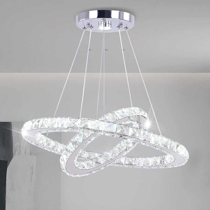 Modern foyer chandelier with crystal rings, offering customizable ambient lighting for elegance and style.