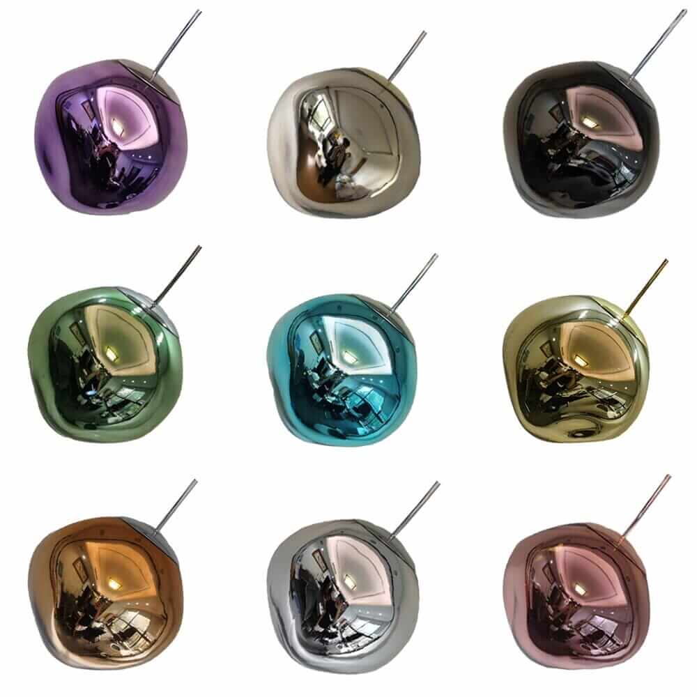 Set of nine colorful decorative glass baubles in various metallic finishes, showcasing unique shapes and modern design.