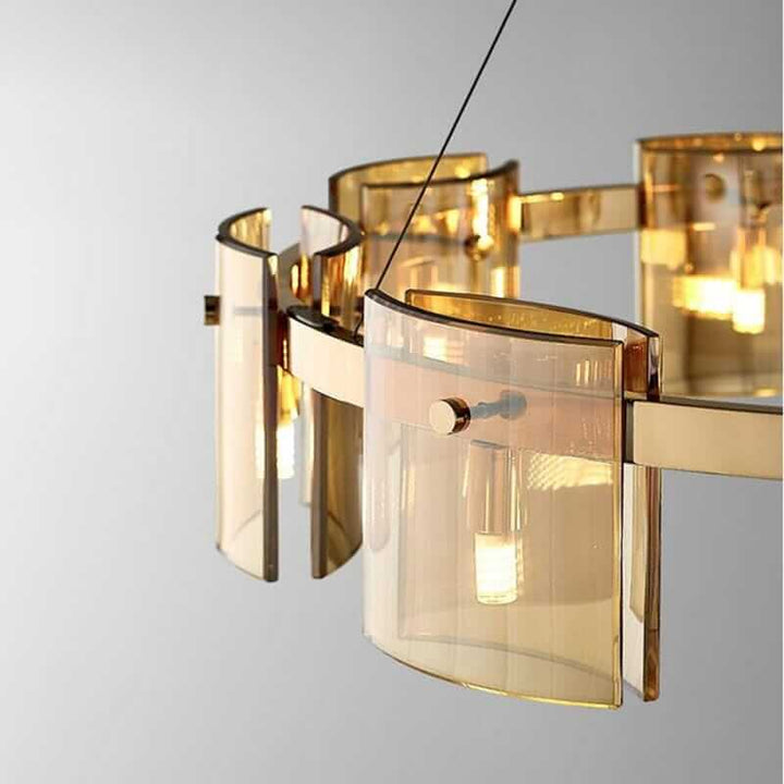 Elegant LED chandelier with gold and glass design, illuminating the room with a warm glow.