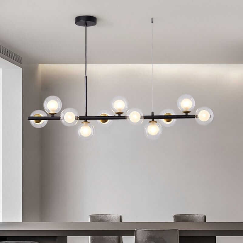 Elegant Bubble Chandelier with clear glass globes and black metal accents hanging in a modern dining area.