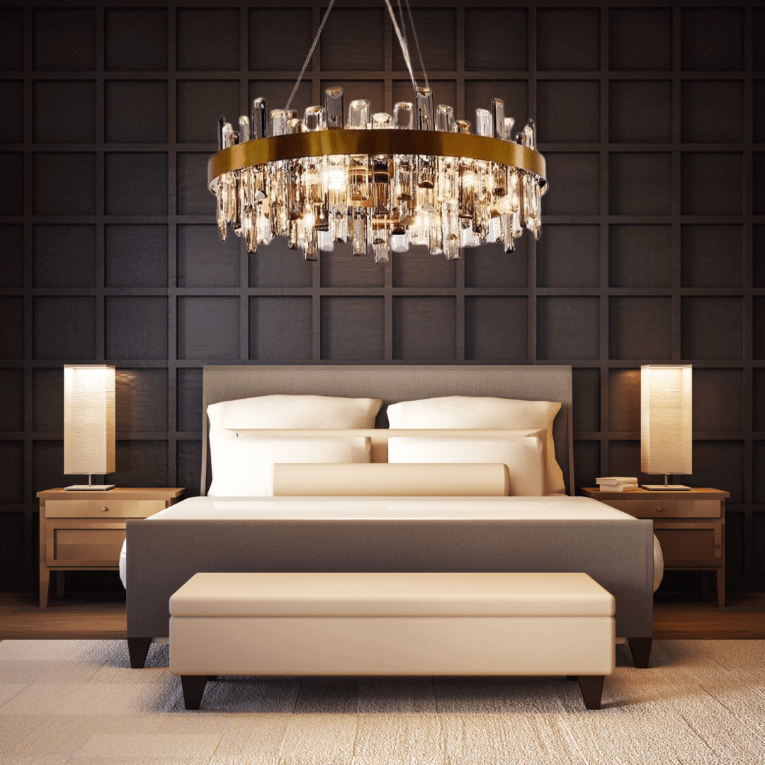 Gold crystal chandelier above a stylish bed in a modern bedroom, adding elegance and luxury to the decor.
