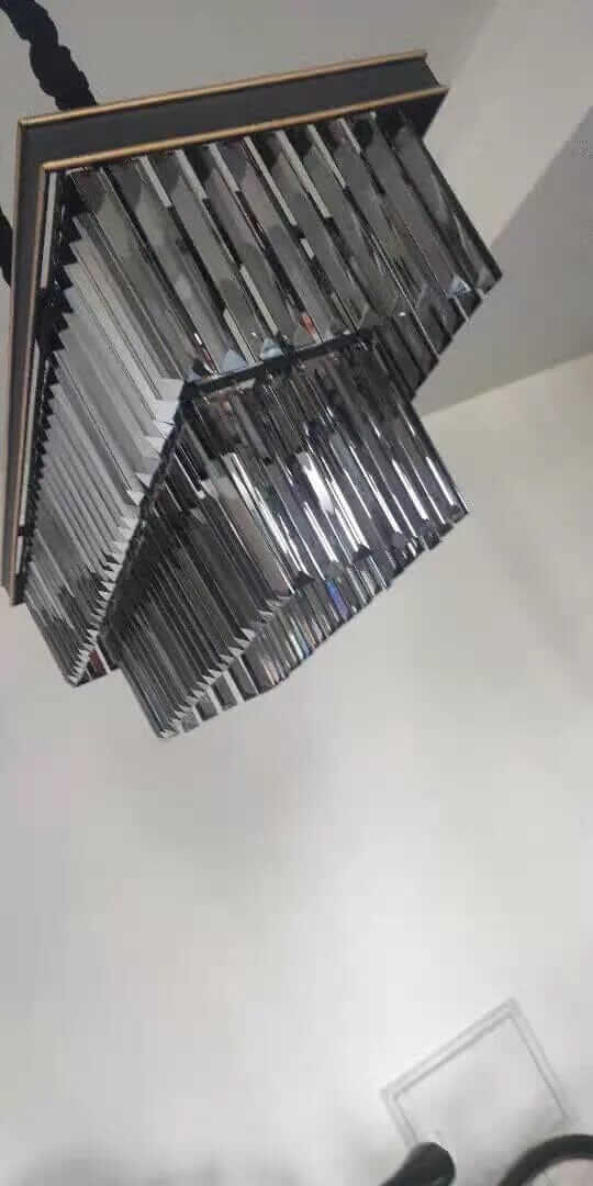 Elegant black chandelier with intricate details, enhancing ambiance and style in home decor.