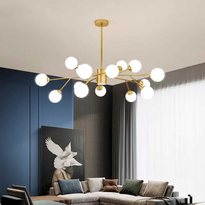 Elegant bubble chandelier in a modern living room with plush sofa and artistic wall decor.