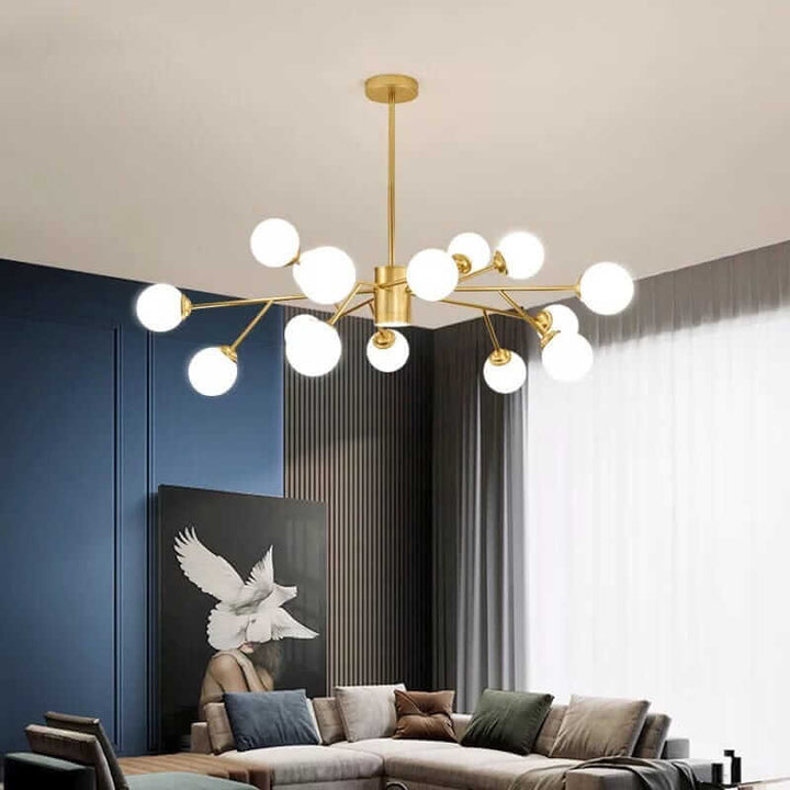 Elegant bubble chandelier in a modern living room with plush sofa and artistic wall decor.