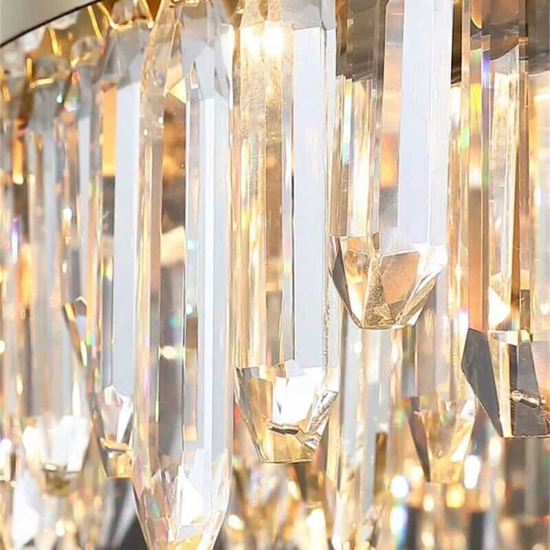 Close-up of gold crystal chandelier features, showcasing elegant hanging crystals reflecting light.
