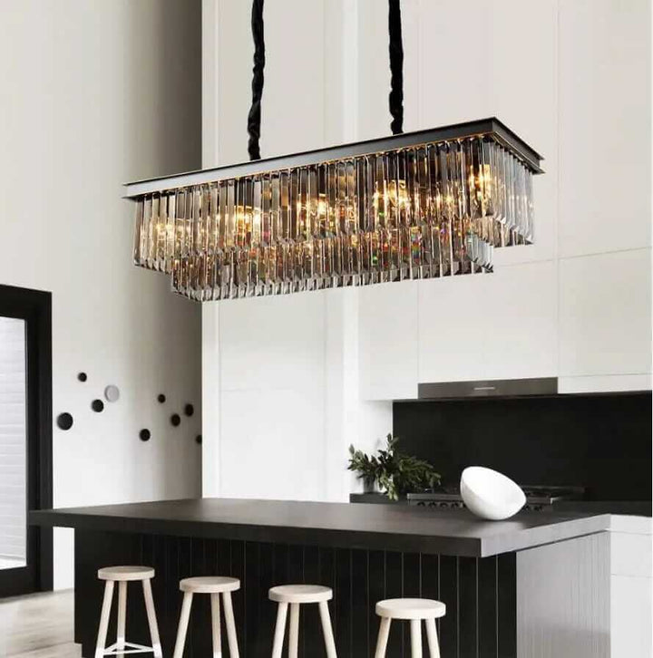 Elegant black chandelier with crystal details illuminating a modern kitchen space, enhancing ambiance and style.