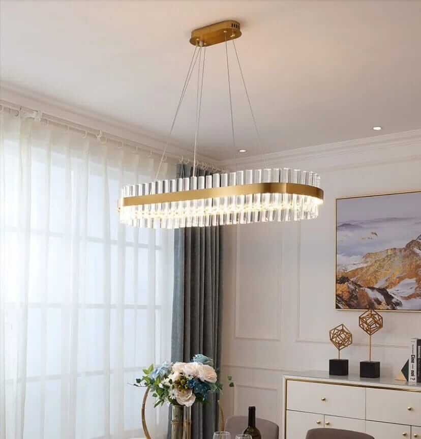 Gold Crystal Chandelier illuminating a modern dining space with elegance and sophistication.