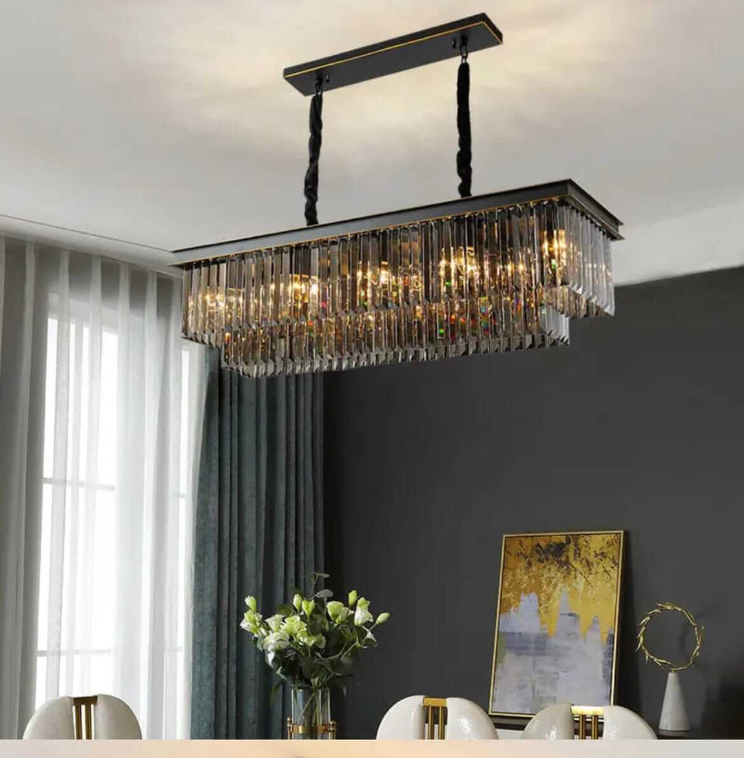 Black chandelier with crystal accents illuminating a modern dining area, creating a luxurious ambiance.
