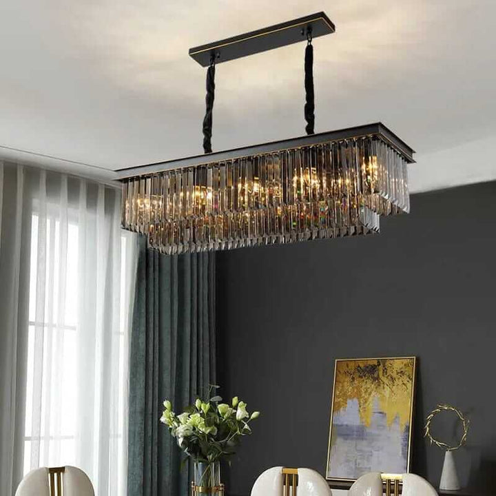 Elegant black chandelier with crystal accents hanging in a modern dining room, creating a stunning ambiance.