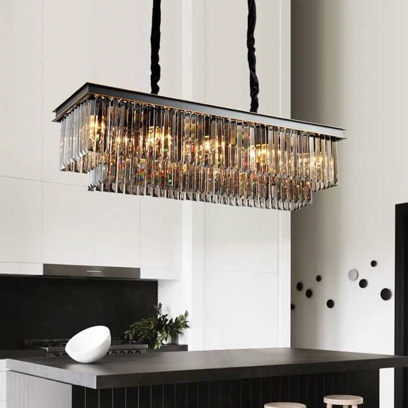 Elegant black chandelier over a modern kitchen island, accentuating the space with shimmering light.