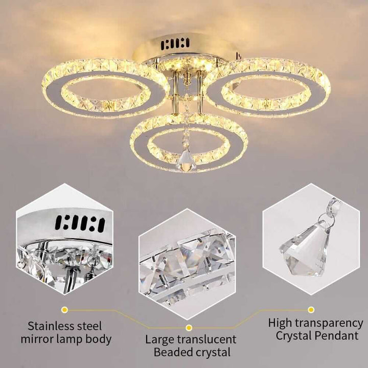 Small crystal chandelier with stainless steel lamp body and translucent beaded crystals, adding elegance to any space.