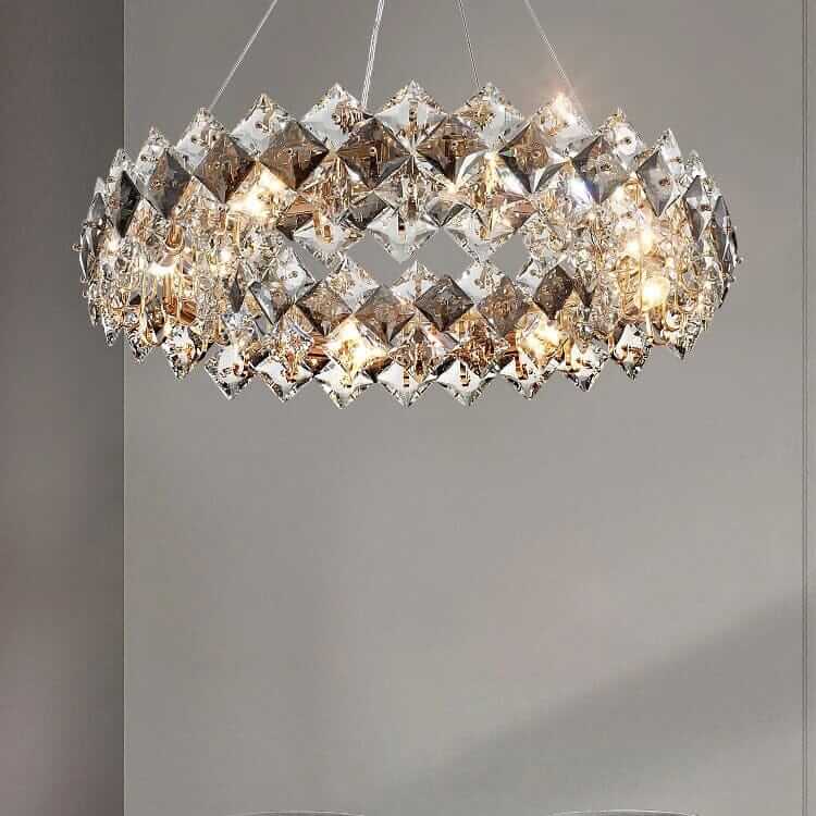 Round chandelier featuring intricate crystal design that shimmers and adds elegance to any room.