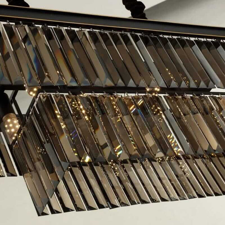 Elegant black chandelier featuring intricate geometric crystal details and radiant lighting elements.