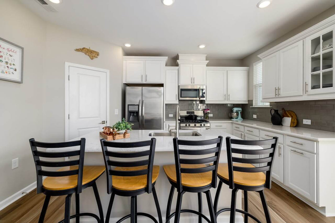Contemporary kitchen featuring stylish bar stools, ideal for modern home decor, emphasizing the best bar stools.