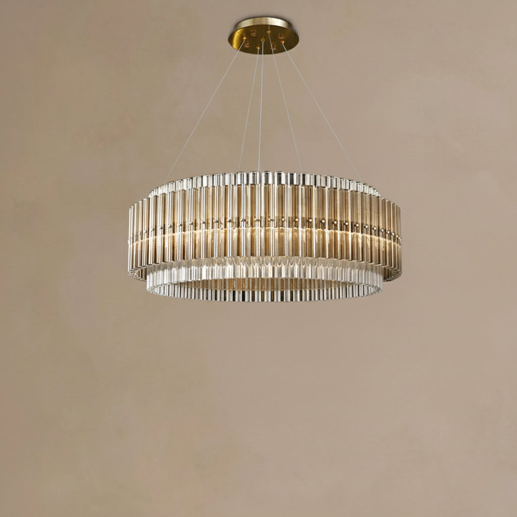 Chandelier hanging from the ceiling against a beige wall