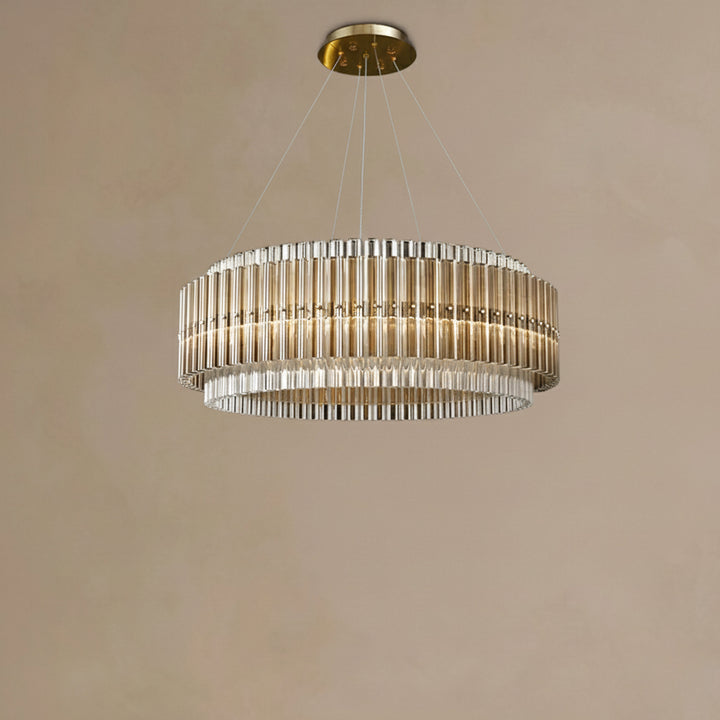 Chandelier hanging from the ceiling against a beige wall