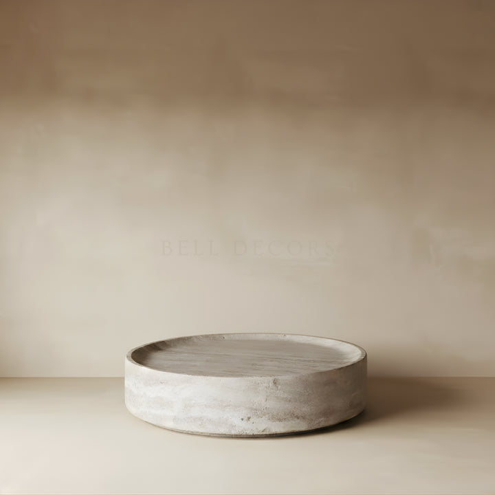 Round concrete tray on a beige background