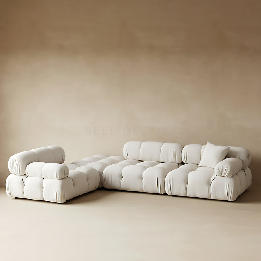 Beige sectional sofa against a beige wall