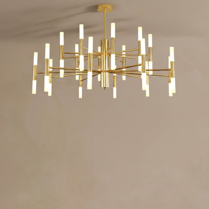 Gold chandelier with multiple light bulbs on a plain background