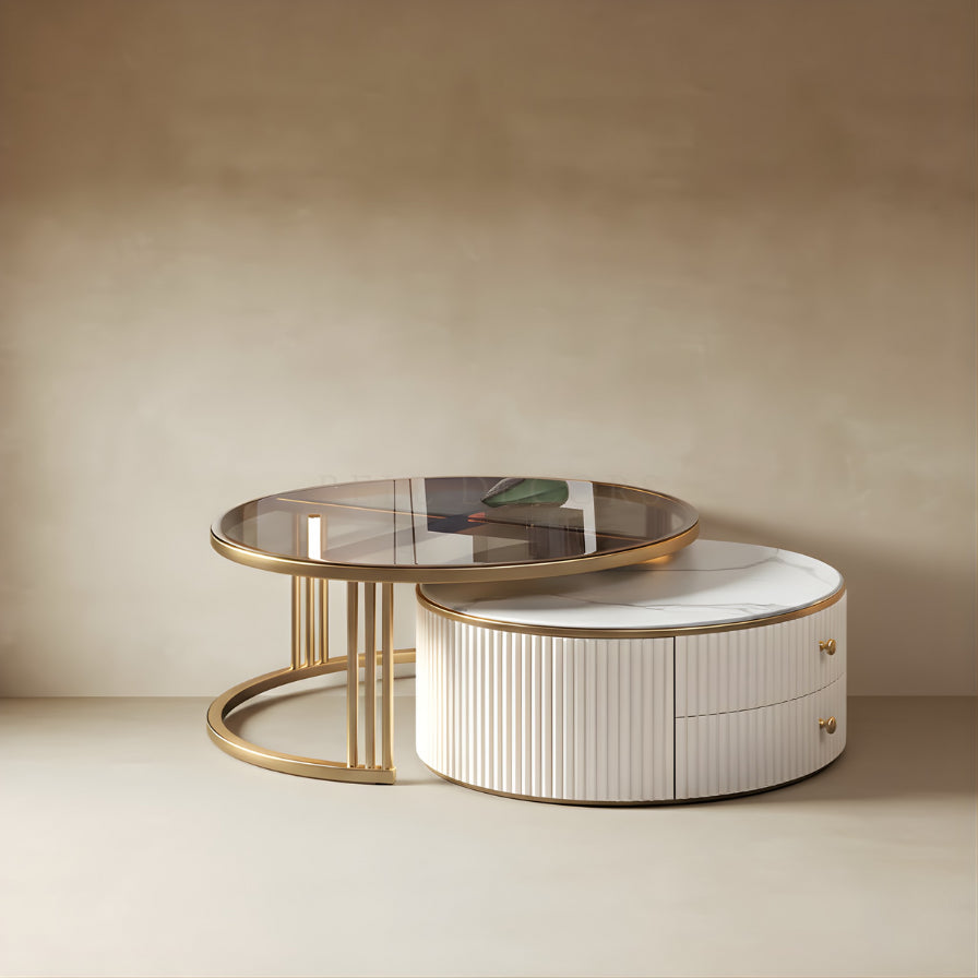 Round coffee table with gold rim and white base against a beige wall
