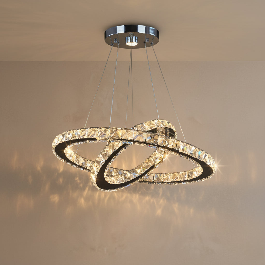 Chandelier with two interlocking rings hanging from the ceiling.