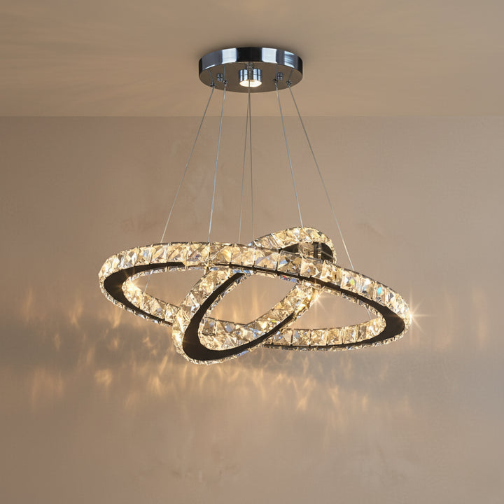 Chandelier with two interlocking rings hanging from the ceiling.